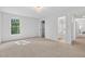 Spacious bedroom offering a view of the bathroom and easy closet access at 4816 Marlborough Way, Durham, NC 27713