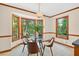 Cozy breakfast nook with a glass-top table and lots of natural light at 4816 Marlborough Way, Durham, NC 27713