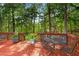 Charming deck featuring potted plants and outdoor furniture, a perfect spot to unwind and enjoy the surrounding greenery at 4816 Marlborough Way, Durham, NC 27713