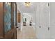 Inviting entryway featuring tile floors, stylish lighting, and a decorative glass front door at 4816 Marlborough Way, Durham, NC 27713