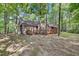 Charming single-story home with a cozy deck surrounded by lush greenery, ideal for outdoor relaxation at 4816 Marlborough Way, Durham, NC 27713