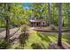 Charming home nestled among mature trees with a well-maintained lawn at 4816 Marlborough Way, Durham, NC 27713