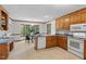 Bright kitchen featuring classic cabinets and breakfast nook with large windows at 4816 Marlborough Way, Durham, NC 27713
