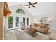 Sunlit living room with french doors, cozy seating, and neutral decor at 4816 Marlborough Way, Durham, NC 27713