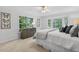 Cozy bedroom with a bay window, soft lighting, and elegant butterfly wall art at 4816 Marlborough Way, Durham, NC 27713