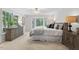 Bright main bedroom with a bay window, soft carpet, and classic decor elements at 4816 Marlborough Way, Durham, NC 27713