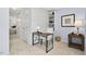 Cozy office nook with a small desk, built-in shelves, and serene lighting perfect for a home office at 4816 Marlborough Way, Durham, NC 27713