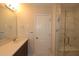 Stylish bathroom featuring a marble-look glass shower, granite counters, modern fixtures, and tile flooring at 5031 Se Jowetts Walk Dr # 28, Cary, NC 27519