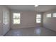 Well-lit bedroom with neutral walls, large windows, and blinds offering comfort and style at 5031 Se Jowetts Walk Dr # 28, Cary, NC 27519