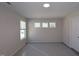 Bright bedroom with multiple windows providing natural light, and neutral-toned walls offering a peaceful atmosphere at 5031 Se Jowetts Walk Dr # 28, Cary, NC 27519