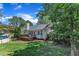A cozy backyard featuring a home, a wooden deck, and an above-ground pool at 52 Malcolm Dr, Clayton, NC 27520