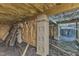 View of the unfinished basement with vapor barrier, insulation, and support blocks at 52 Malcolm Dr, Clayton, NC 27520