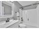 Well-lit bathroom with modern fixtures, white vanity, and shower-tub combination at 52 Malcolm Dr, Clayton, NC 27520