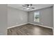 Bright bedroom featuring wood flooring and a sunny window at 52 Malcolm Dr, Clayton, NC 27520