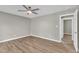 Spacious bedroom with neutral paint, wood flooring, and a ceiling fan at 52 Malcolm Dr, Clayton, NC 27520
