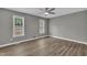 Comfortable bedroom with abundant natural light and modern ceiling fan at 52 Malcolm Dr, Clayton, NC 27520