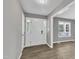 Bright entryway featuring hardwood floors, a modern front door, and a view into the living area at 52 Malcolm Dr, Clayton, NC 27520