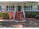 Charming front porch with brick stairs, providing an inviting entrance to the home at 52 Malcolm Dr, Clayton, NC 27520