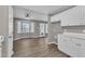 Inviting kitchen area features a bay window, white cabinets, and lots of natural light at 52 Malcolm Dr, Clayton, NC 27520