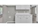 White cabinets and neutral walls, this kitchen area is bright and ready for any homeowner at 52 Malcolm Dr, Clayton, NC 27520