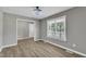 Bright, airy living room featuring sleek wood floors and a modern ceiling light fixture at 52 Malcolm Dr, Clayton, NC 27520