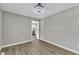 Clean, modern living room with hardwood floors, offering a glimpse into the adjacent kitchen at 52 Malcolm Dr, Clayton, NC 27520
