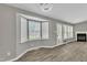Open floor plan with great natural light, white walls, and stylish wood flooring throughout at 52 Malcolm Dr, Clayton, NC 27520