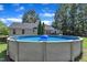 A backyard with an above-ground pool and blue inflatable raft at 52 Malcolm Dr, Clayton, NC 27520