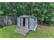 View of the shed in the backyard with a wood platform in front of it at 52 Malcolm Dr, Clayton, NC 27520