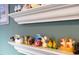 Close up of a shelf with an assortment of decorative figurines and trinkets at 527 N Cypress St, Wendell, NC 27591