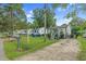 Charming cottage-style home featuring a well-manicured lawn and a shared driveway at 527 N Cypress St, Wendell, NC 27591
