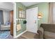 Inviting foyer featuring coat rack, a mirror and a view into a living room at 527 N Cypress St, Wendell, NC 27591