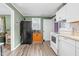 Bright kitchen has an open layout connecting to the living area featuring modern appliances at 527 N Cypress St, Wendell, NC 27591