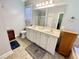 Spacious bathroom featuring double sinks, sleek countertops, and walk-in shower at 55 Ridge Haven Dr, Louisburg, NC 27549