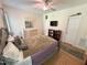 Cozy bedroom featuring hardwood floors, a ceiling fan, and ample closet space at 55 Ridge Haven Dr, Louisburg, NC 27549