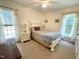 Cozy bedroom with carpet flooring, natural light, and neutral paint and textiles at 55 Ridge Haven Dr, Louisburg, NC 27549