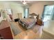 Well-lit bedroom featuring hardwood floors, a ceiling fan, and relaxing decor at 55 Ridge Haven Dr, Louisburg, NC 27549