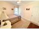 Carpeted bedroom featuring a bed, two windows, neutral paint, and a ceiling fan at 55 Ridge Haven Dr, Louisburg, NC 27549