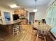 Modern kitchen with sleek countertops, stainless steel appliances, eat-in area, and smooth transition to dining area at 55 Ridge Haven Dr, Louisburg, NC 27549