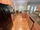 Modern kitchen with stainless appliances, island seating and open floor plan, and easy access to an eat-in dining area at 55 Ridge Haven Dr, Louisburg, NC 27549