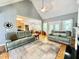 Bright, open living room showcasing hardwood floors, a fireplace, and an adjacent kitchen area at 55 Ridge Haven Dr, Louisburg, NC 27549
