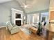 Inviting living room features hardwood floors, a fireplace, and a vaulted ceiling with a ceiling fan at 55 Ridge Haven Dr, Louisburg, NC 27549