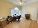 Office with hardwood flooring, desk set, windows, and neutral paint colors at 55 Ridge Haven Dr, Louisburg, NC 27549