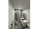 Stylish bathroom featuring patterned tile, black hardware, and a sleek vessel sink at 5809 Iris Lake Ct, Raleigh, NC 27604