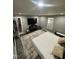 Spacious bedroom featuring a television, stylish decor, and comfortable rug at 5809 Iris Lake Ct, Raleigh, NC 27604