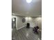 Bedroom featuring gray walls, laminate floors, and decorative wall accents at 5809 Iris Lake Ct, Raleigh, NC 27604
