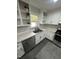 Kitchen with white cabinets, white countertops, stainless steel appliances and backsplash with eye-catching pattern at 5809 Iris Lake Ct, Raleigh, NC 27604