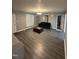Inviting living room features contemporary flooring, neutral tones, and lots of natural light at 5809 Iris Lake Ct, Raleigh, NC 27604