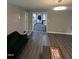 Bright living space featuring modern floors, neutral paint, and a glimpse into laundry room at 5809 Iris Lake Ct, Raleigh, NC 27604
