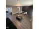 Open-concept living room with modern flooring, a neutral palette, and stylish finishes at 5809 Iris Lake Ct, Raleigh, NC 27604
